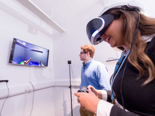 Kingston University students using virtual reality equipment