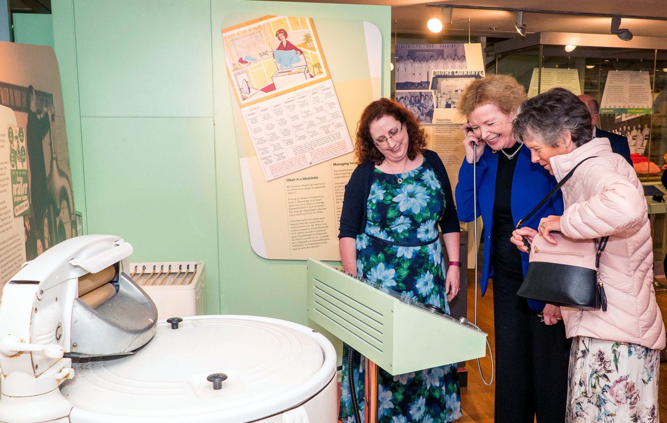 Dr Sorcha O\'Brien showing the oral history audio to Mary Robinson and Brigid O\'Brien, oral history participant.