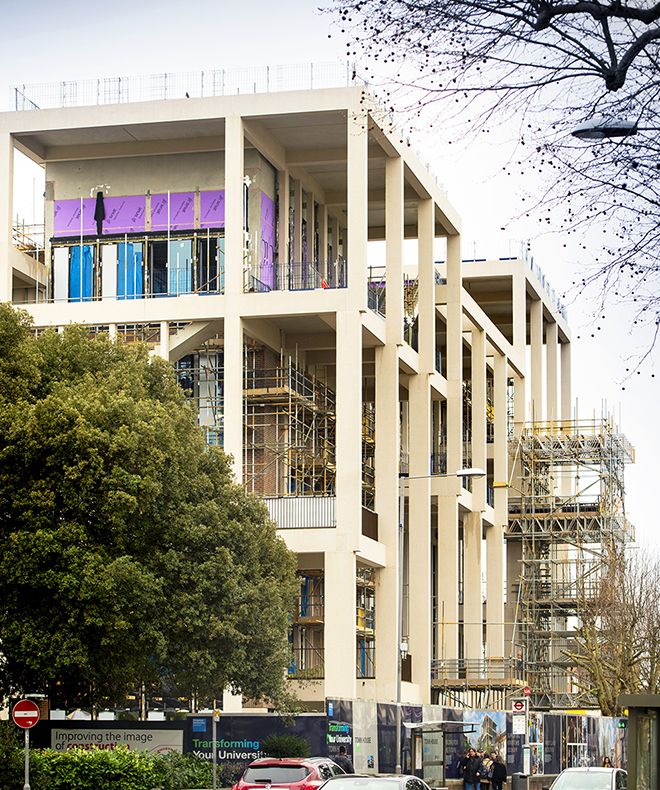 A side view of the Town House building during construction in March 2019