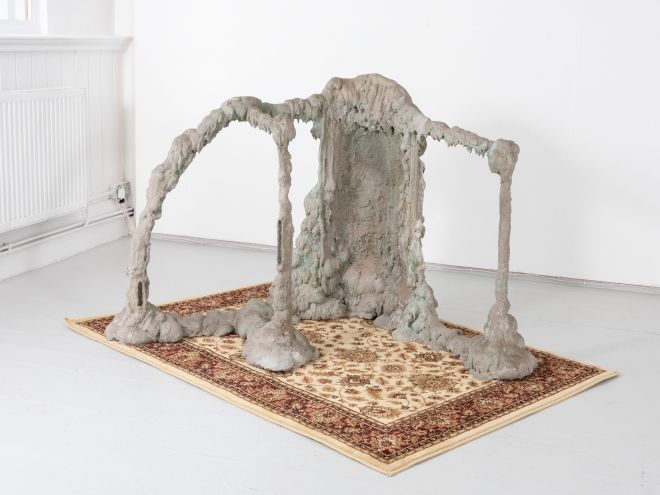 Image of a sculpture on a rug