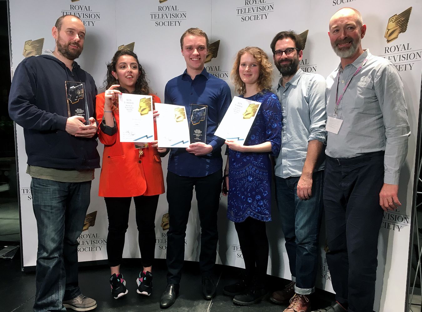 Matt (centre) pics up his award alongside fellow nominees Media Shabani (left) and Tash Dupker.  