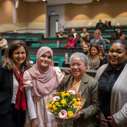 Dame Elizabeth Anionwu (second from right) was given some flowers by students and Professor Reem Kayyali (left) following a Q&A session