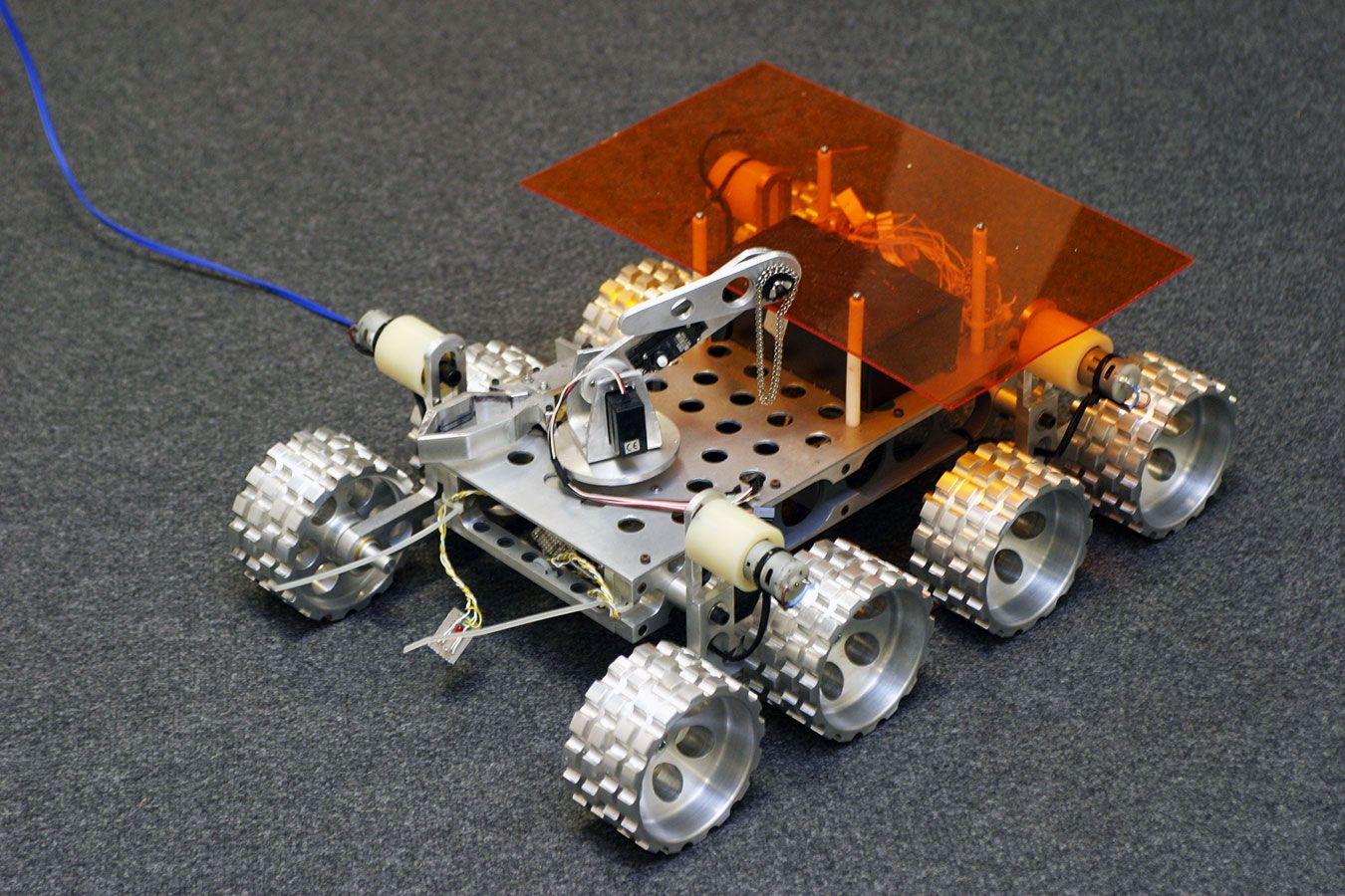 A photo of a small car-like robot from the mechanical engineering labs at Kingston University.