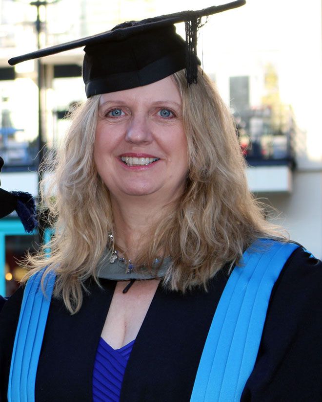 A photo of graduate Wendy French in her Kingston University graduation robes.