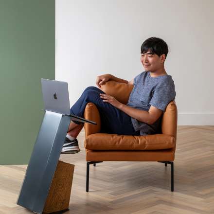 Sung Kim's Table Work lounge side table transforms into the perfect workstation or ergonomic film viewer. 