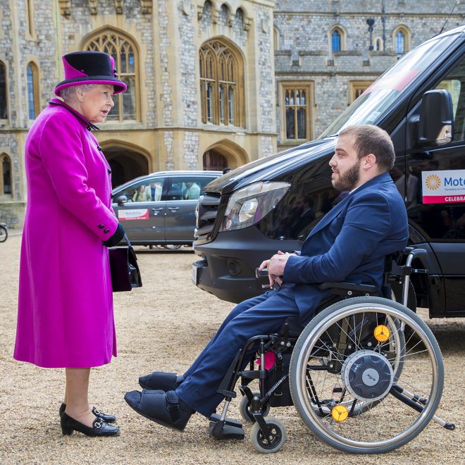 An image of the Queen and Edward Tonino and his new motability van at Windsor Castle