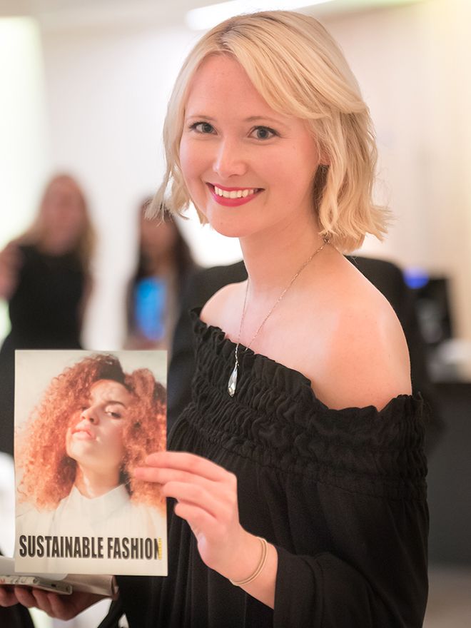 Jessica Joy Donnelly holds a copy of her magazine, Sustainable Fashion Journal.