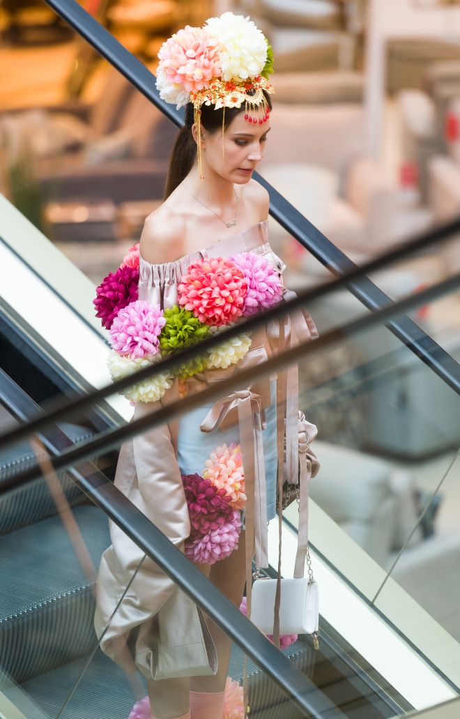 Garments by Ningyao Zhang being modelled on the escalators through Bentalls department store.