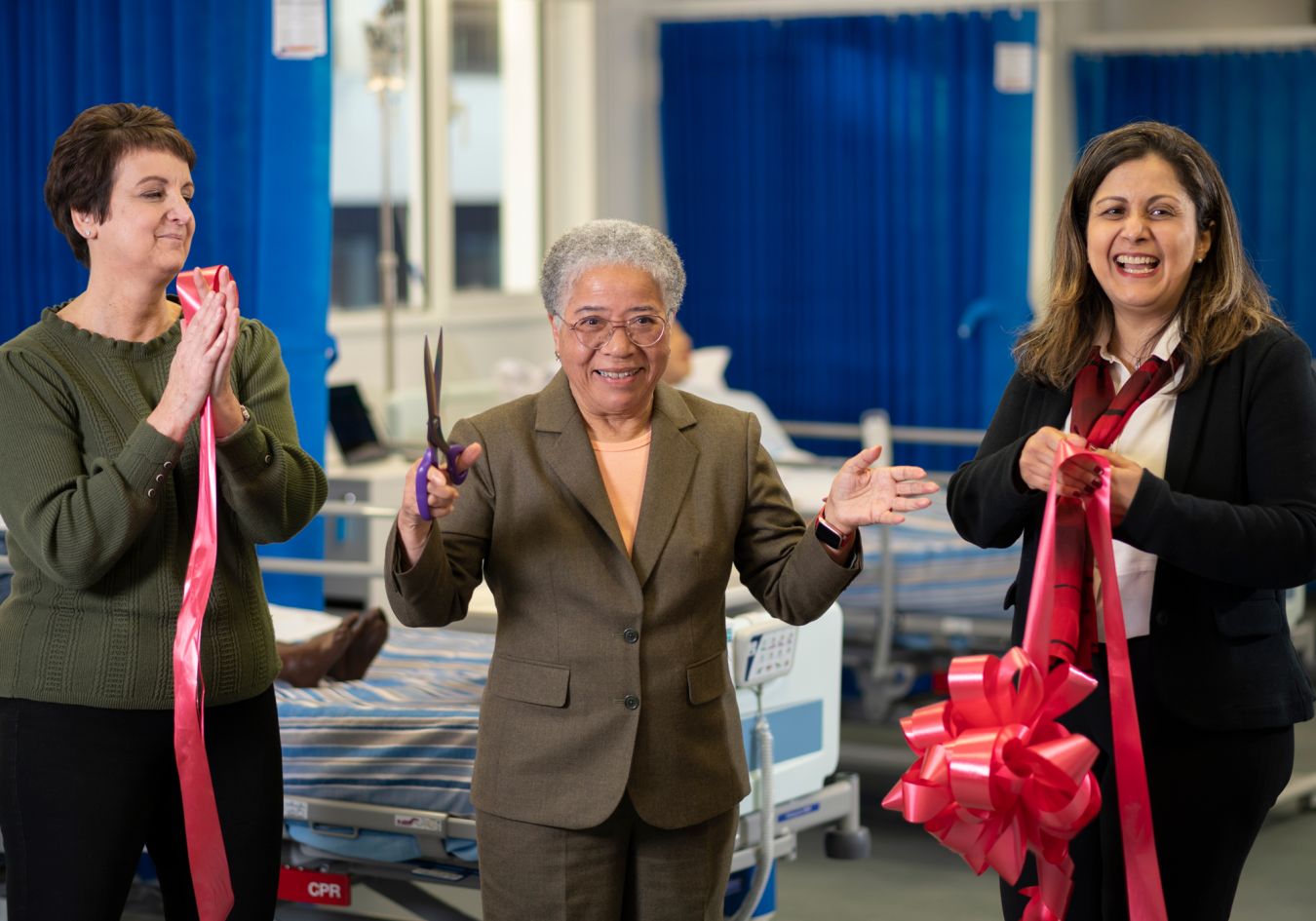 Dame Elizabeth Anionwu was invited to open the hi-tech suites after having the mock hospital ward named after her. Dame Elizabeth (centre) cut the ribbon held by Simulation Unit Manager Jo Low (left) and Head of the Pharmacy Department Professor Reem Kayyali (right).