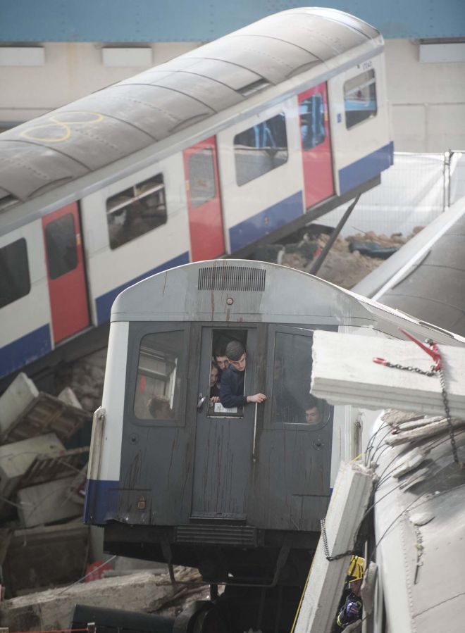 Volunteer casualties wait to be rescued from one of the train carriages in the staged incident. Image: REX/Shutterstock