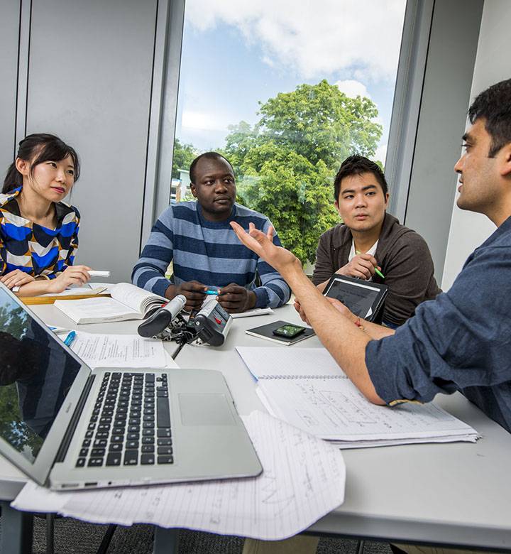 Postgraduate students in group study room