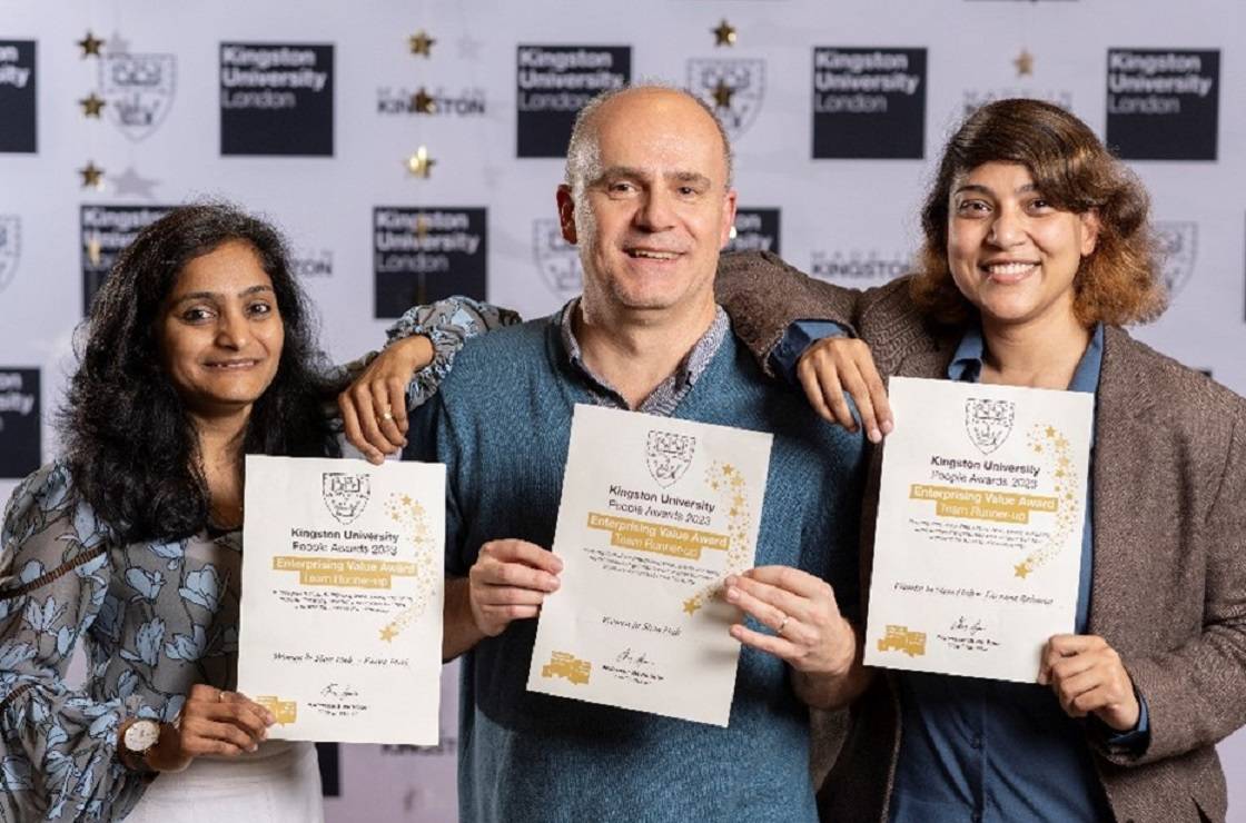 Kingston University People Award ‘Enterprising' runner-ups smiling at camera and holding certificates