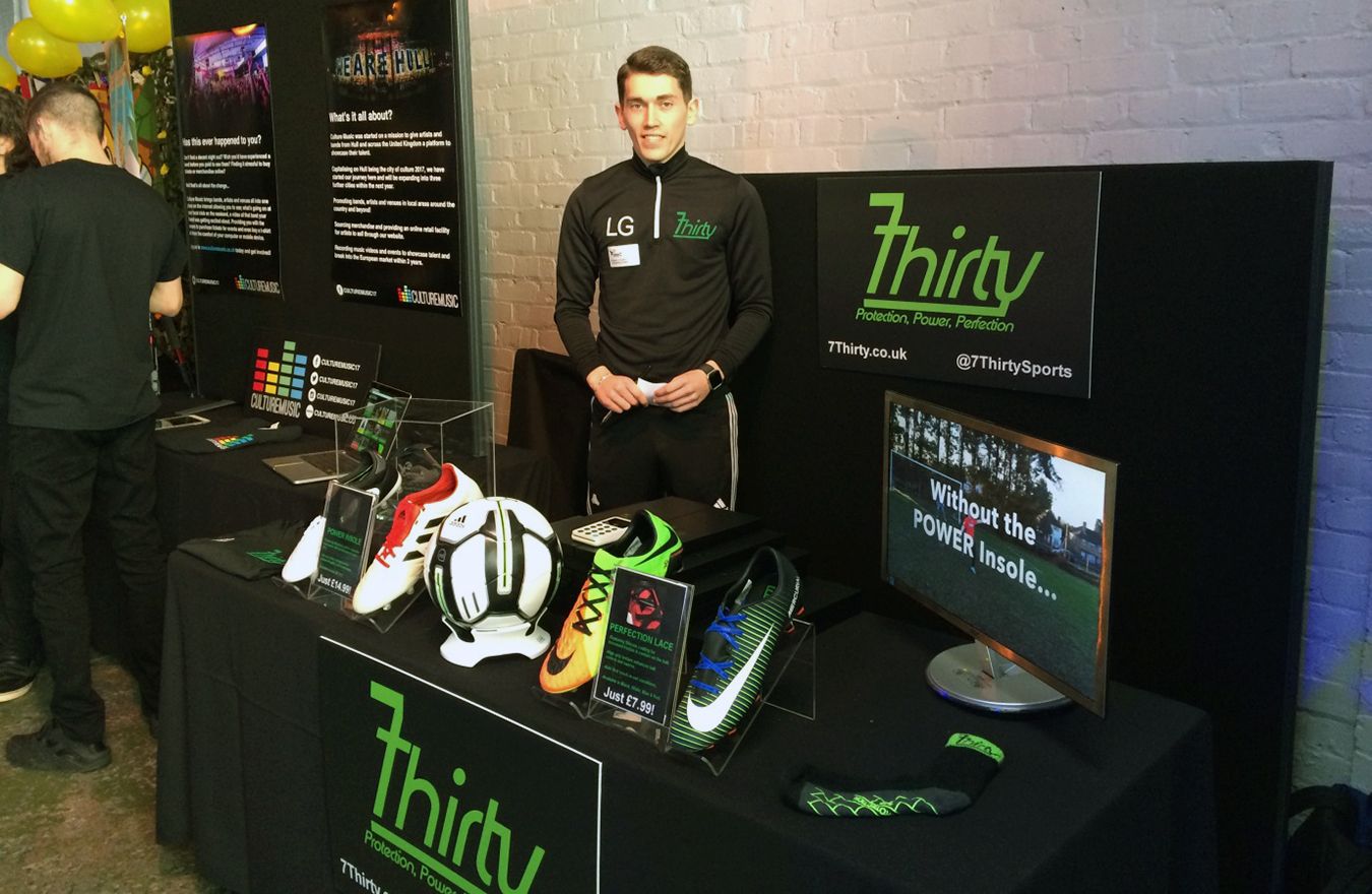 Lucas Griffin stands at the 7Thirty stall, which is displaying the football boot technology that the company sells