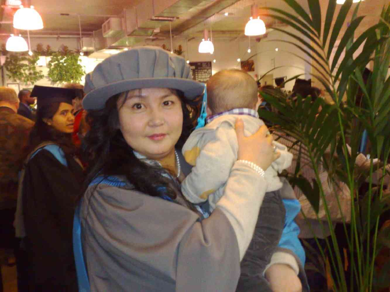 Dr Munkhchimeg (Moon) Ganbold and child - Graduation Day