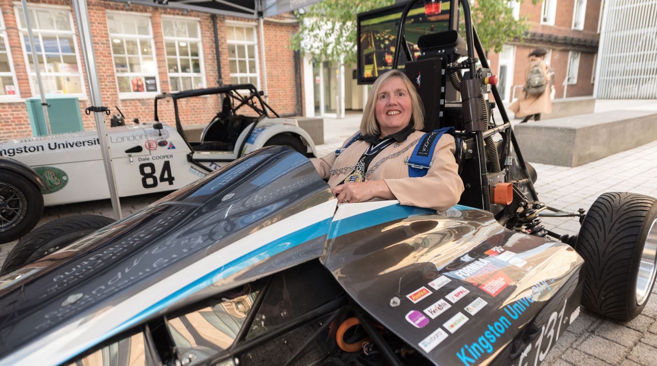 Mayor of Kingston Cllr Julie Pickering gets behind the wheel of the University\'s e-Racing car at the Civic Reception event.