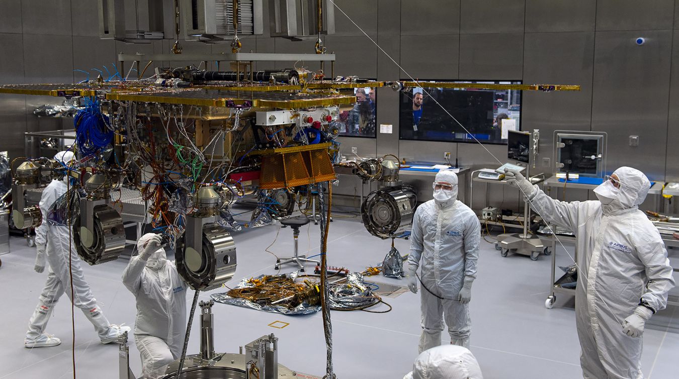 A team of skilled engineers and technicians led by Kingston University graduate Mahilal De Silva work on the Mars Rover build at the Airbus facility in Stevenage. Photo: Max Alexander/Airbus 