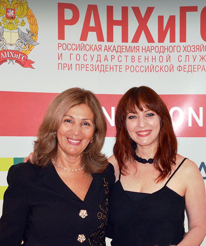 A photo of two women at the Moscow MBA event.