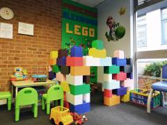 Kingston University graduate revamps hospital waiting room with 11kg of Duplo Lego to bring colour and positivity to patients