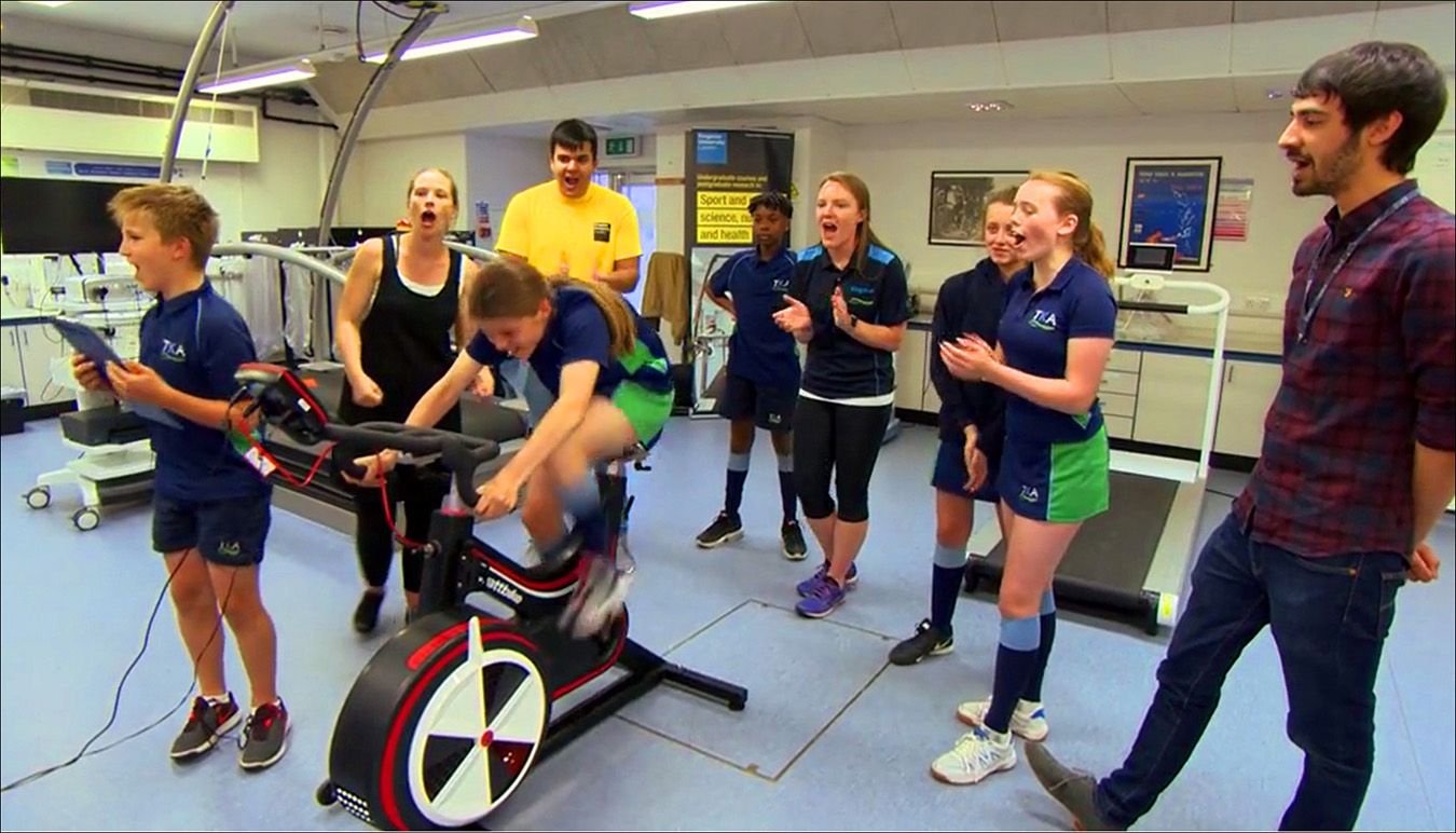 A photos of students from The Kingston Academy on sports science equipment