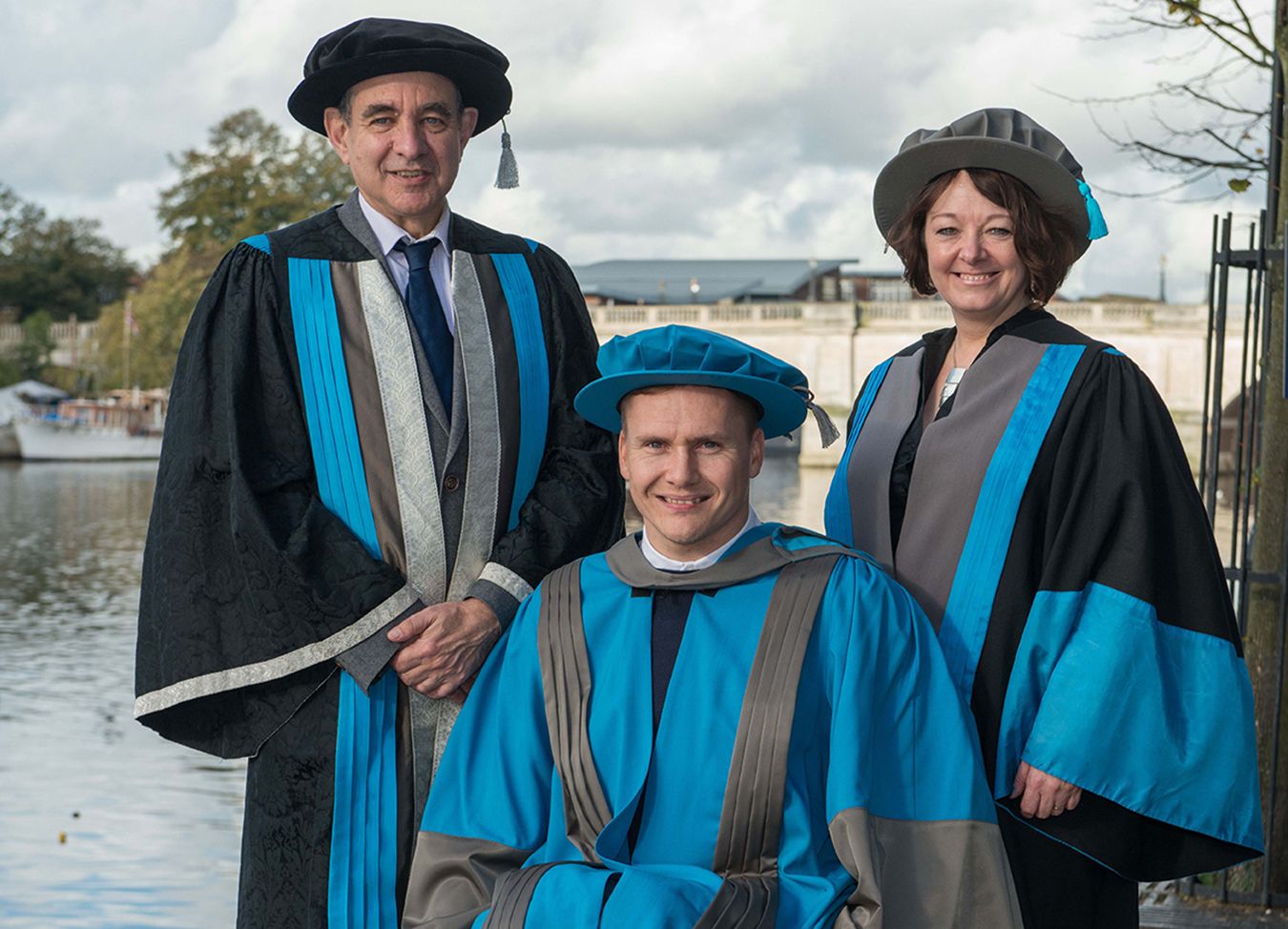 Kingston University Vice-Chancellor Professor Julius Weinberg, left, and interim Dean for the Faculty of Science, Engineering and Computing Dr Lucy Jones applauded honorary degree recipient David Weir for being an inspirational ambassador for disabled sports. 