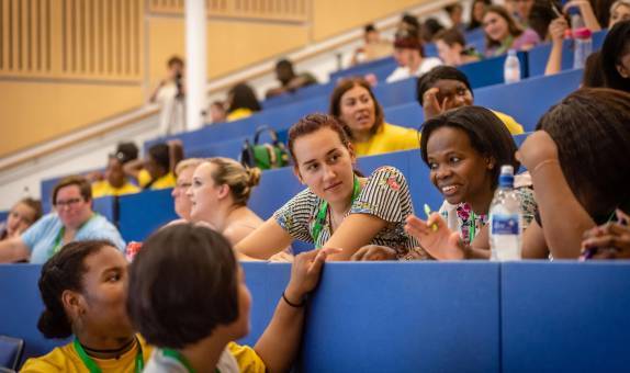 Smiling students in a lecture theatre