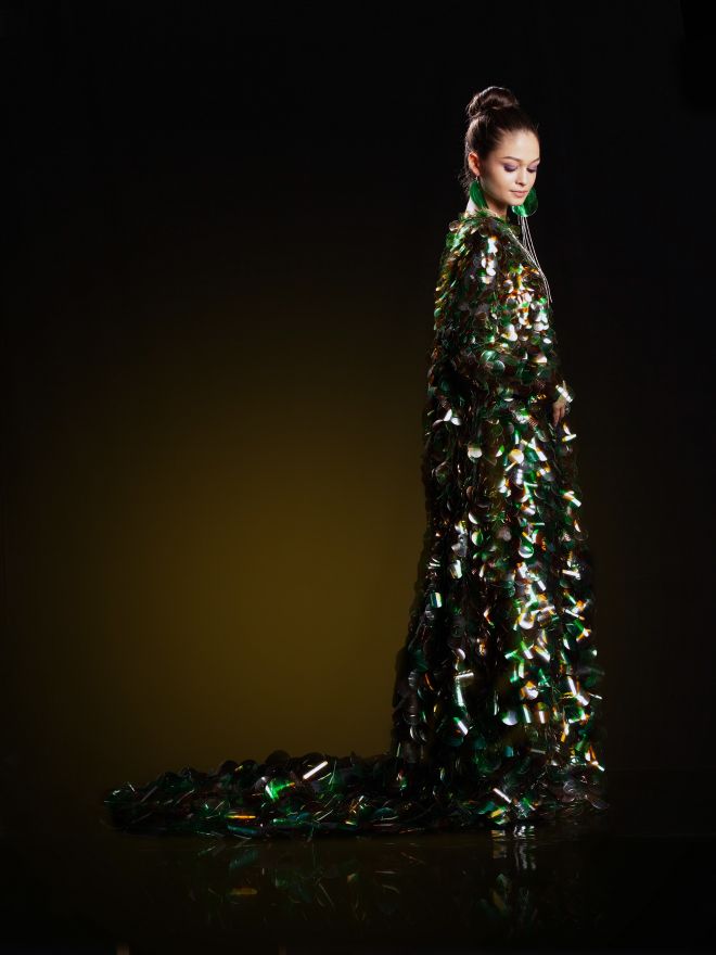 Aura Olarean has created eight dresses, each adorned with clear, green or brown plastic, which she hopes will highlight plastic use and create a more environment-friendly approach.