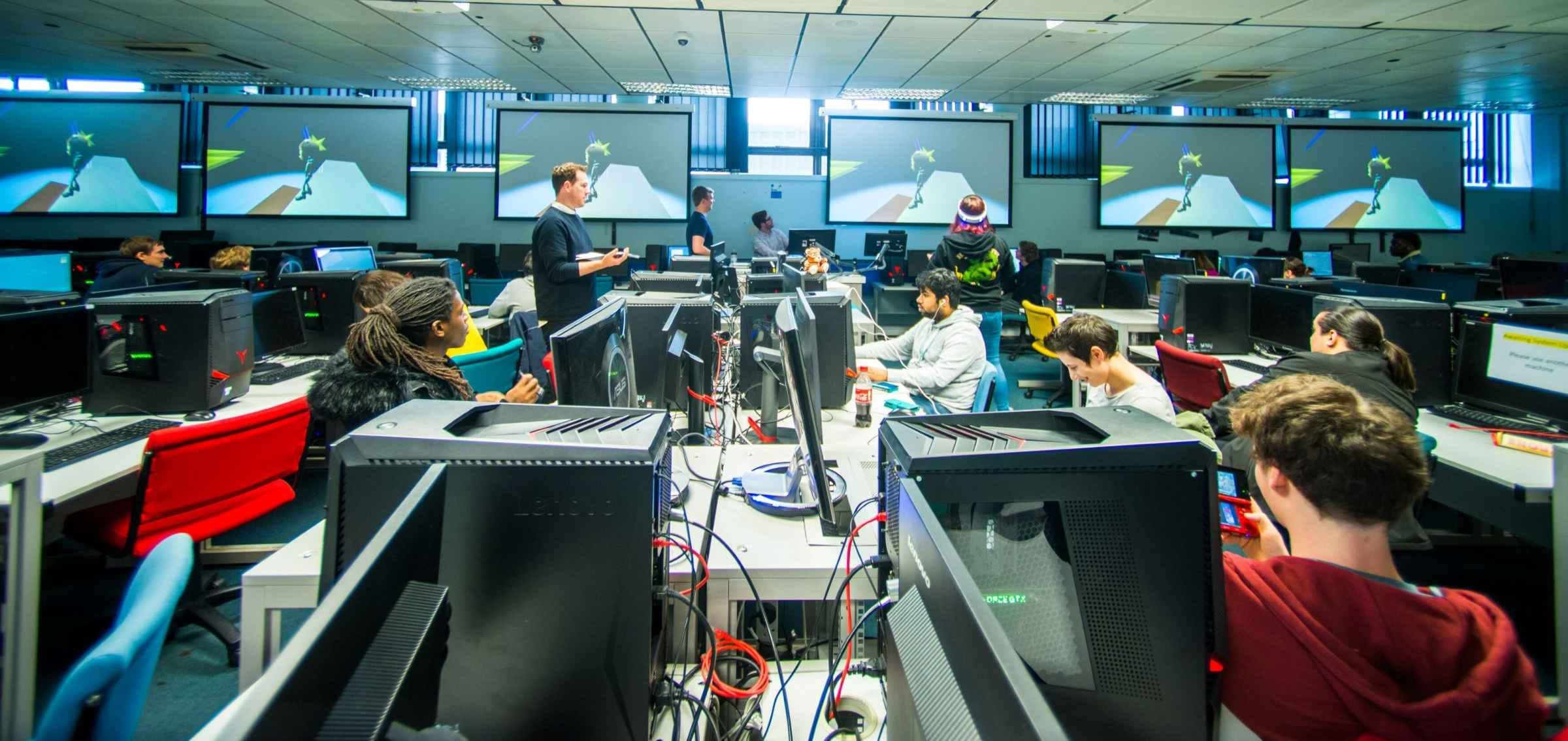 Students working in a computer suite.
