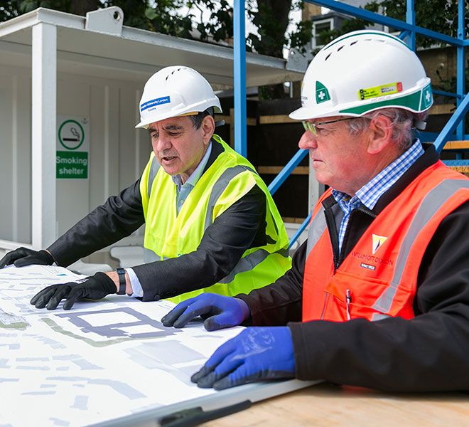 Professor Julius Weinberg and Willmott Dixon Manager Paul Brewer looking at plans for the new Town House building