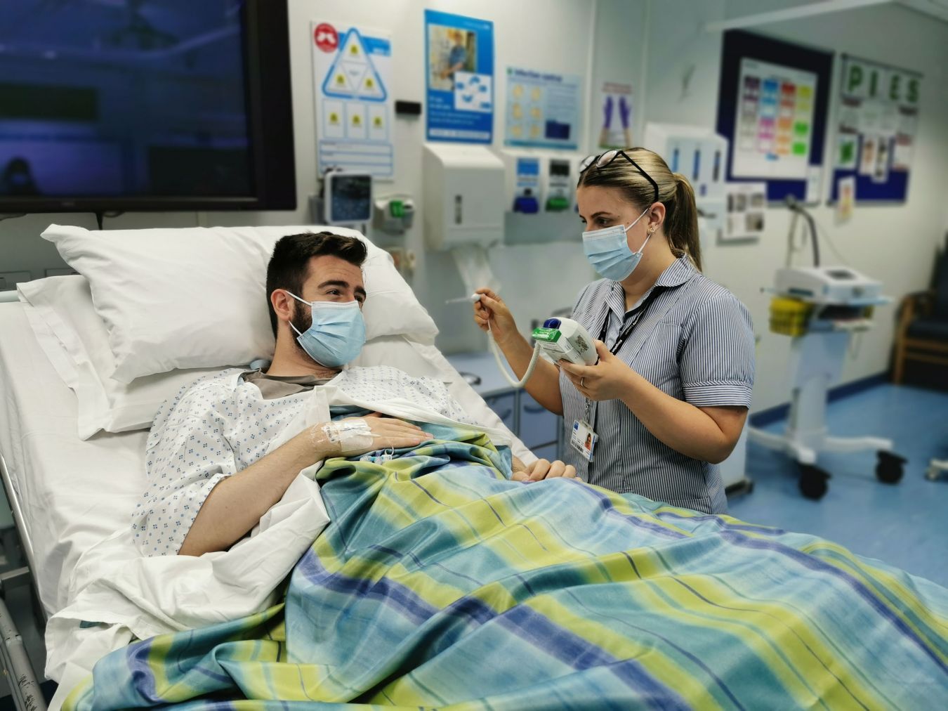 Student taking blood pressure from a simulated patient