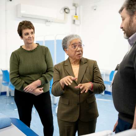 Dame Elizabeth Anionwu chatting to Kingston University staff in the new GP surgery suite