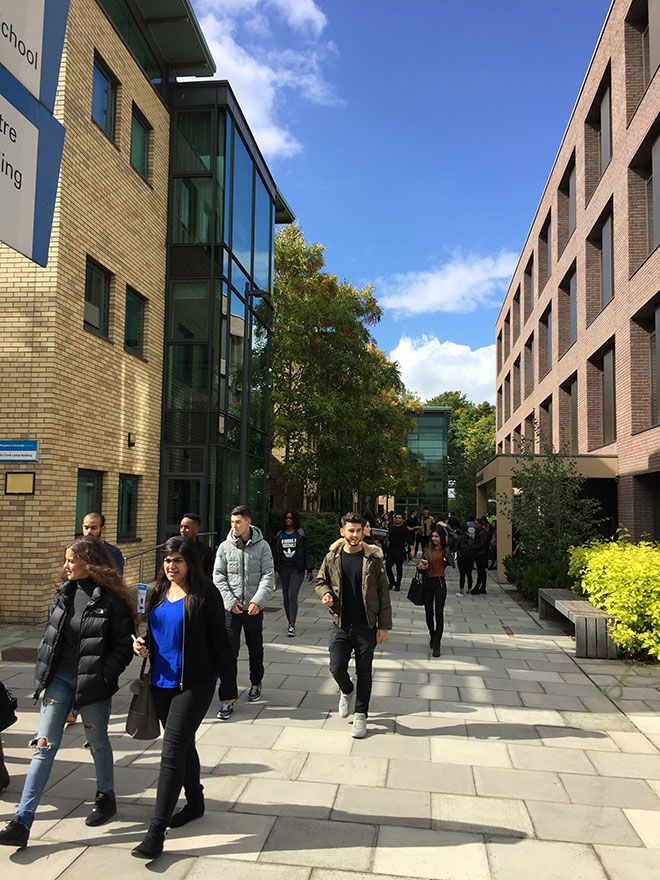 Photograph of students walking outside Kingston Business School