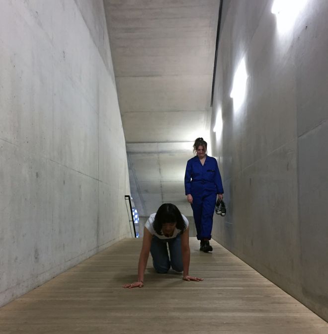 Kingston University fine art student \'Srijana Gurung performs a crawl as part of No Working Title