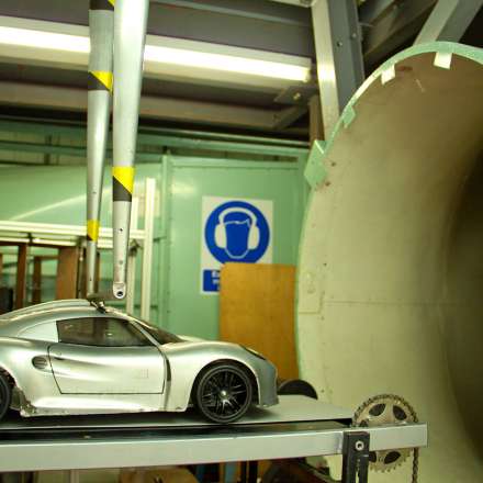 Testing aerodynamic design of a car scale model in wind tunnel