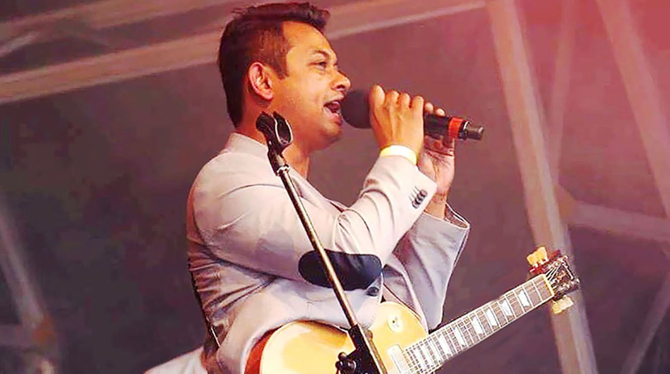 A photo of Clearing case-study student Ershad Alamgir singing at a festival