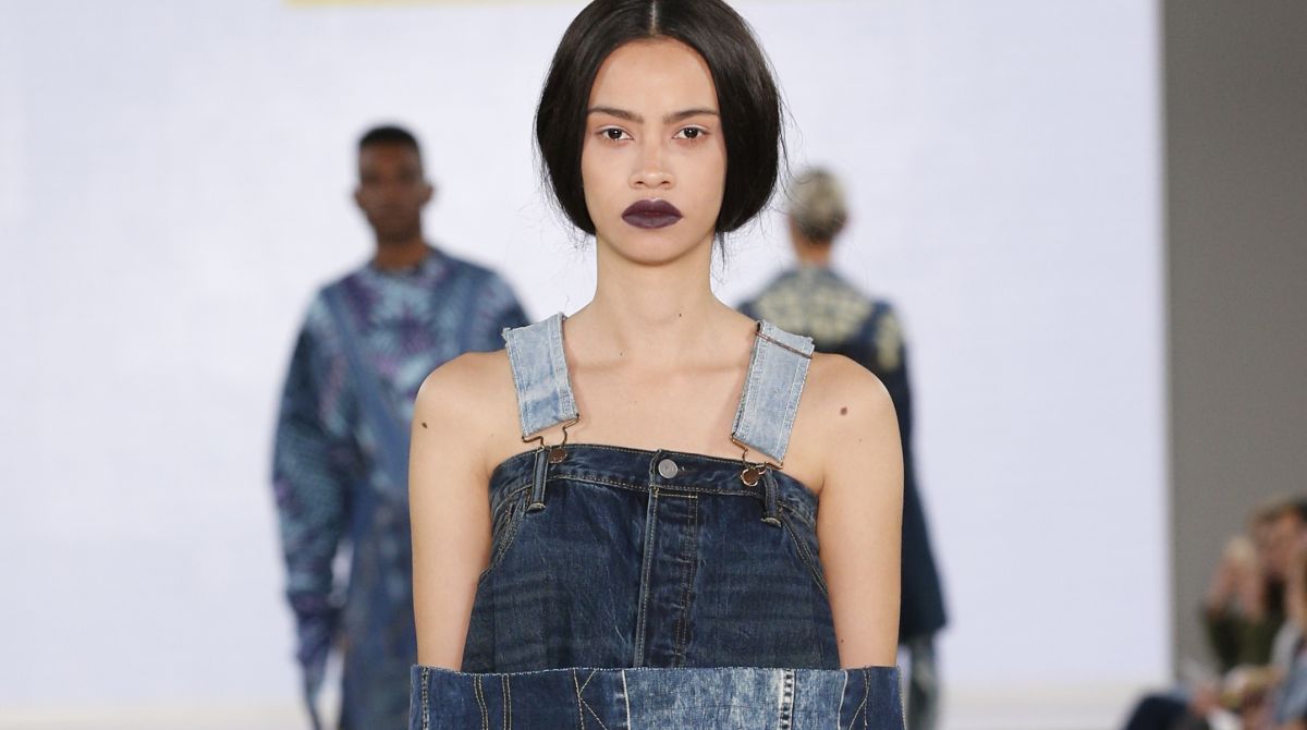 Kingston University designer's sustainable fusion of denim and African fabrics modelled at Graduate Fashion Week by industry icon Caryn Franklin