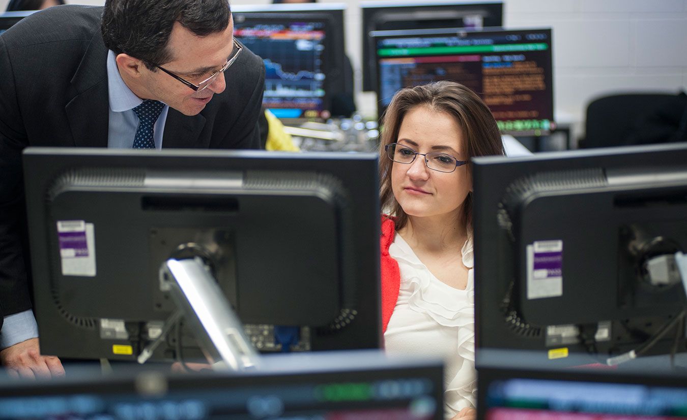 A picture of some postgraduate students in the Bloomberg room at Kingston Business School