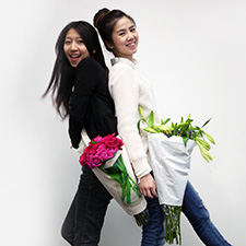 Daisy Wang, left, and Winnie Lao are the brains behind the reusable Pozzy flower carrier.