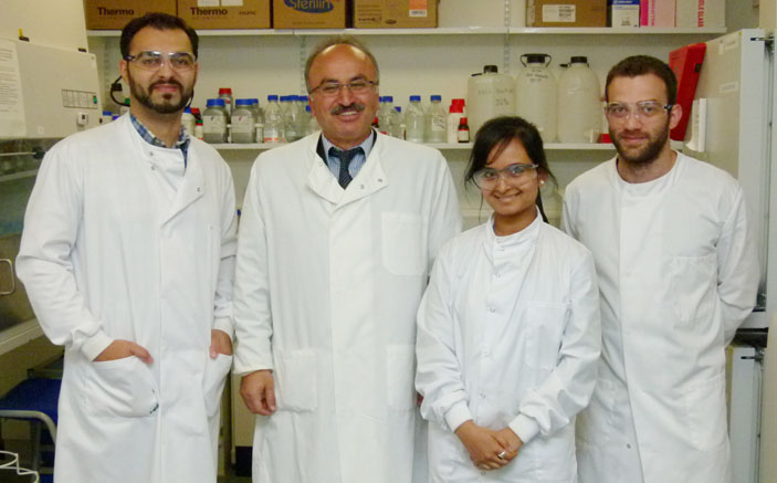 Professor Helmout Modjtahedi, second left, with PhD students, from left, Said Khelwatty, Soozana Puvanenthiran and Nikolaos Ioannou in the Kingston University laboratories.