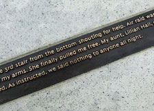 Small bronze plaques on the memorial contain testimonials from survivors, emergency service personnel and relatives.