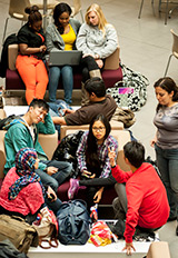 Students in the atrium of the Business School building