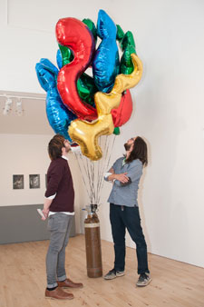 Fine Art graduate Adam Jones, left, and artist Andy Holden with a balloon installation inspired by Stanley Picker's days in the cosmetics industry.