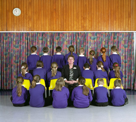 A class photo of children at Mildene Primary School - the only face visible is the teacher's.