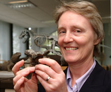 Dr Angela Milner, from London's Natural History Museum, holds a miniature skeleton replica of Baryonyx. In her interviews she recalls how she discovered the dinosaur.