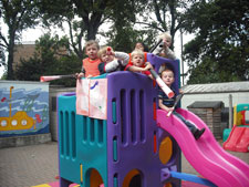 Youngsters at Kingston University Nursery celebrate their outstanding report. 