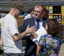 Senior research fellow Dr Kevin Burchell, left, and Professor Ruth Rettie discuss the Smart Communities project with MP Ed Davey.