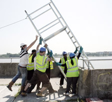 Kingston University Architecture students hoist the ladder into position