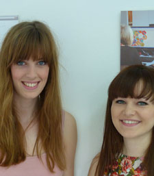 Rachel Mintern, left, and Sophie Burt with the branding for their award-winning Mid Way idea.