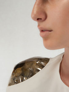 A shoulder pad designed by Ninela Ivanova – complete with mould growing inside the PVC.