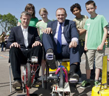 MPs Zac Goldsmith, left, and Ed Davey put their pedal power to the test on electricity generating bicycles watched by pupils from Fern Hill Primary School.