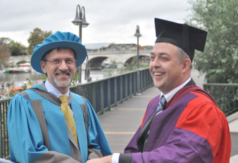 Dr Tony Walker, from Kingston University’s School of Life Sciences, right, congratulates Professor Lane on being named an Honorary Doctor of Science. 